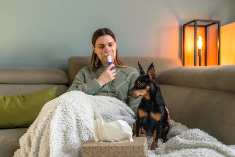 A 40-year-old woman inhales with a nebulizer